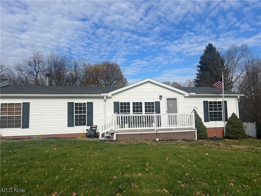 Front view with large front porch.