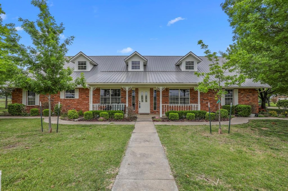 Extravagant front view with well kept landscaping