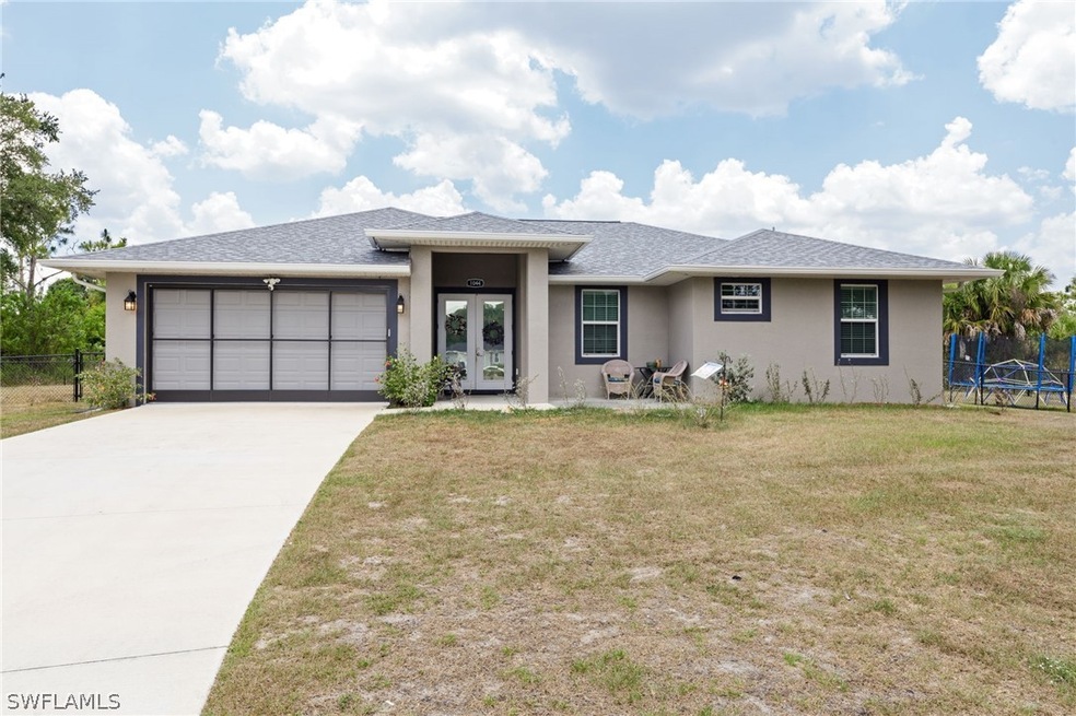 View of front facade with a garage and a front yar