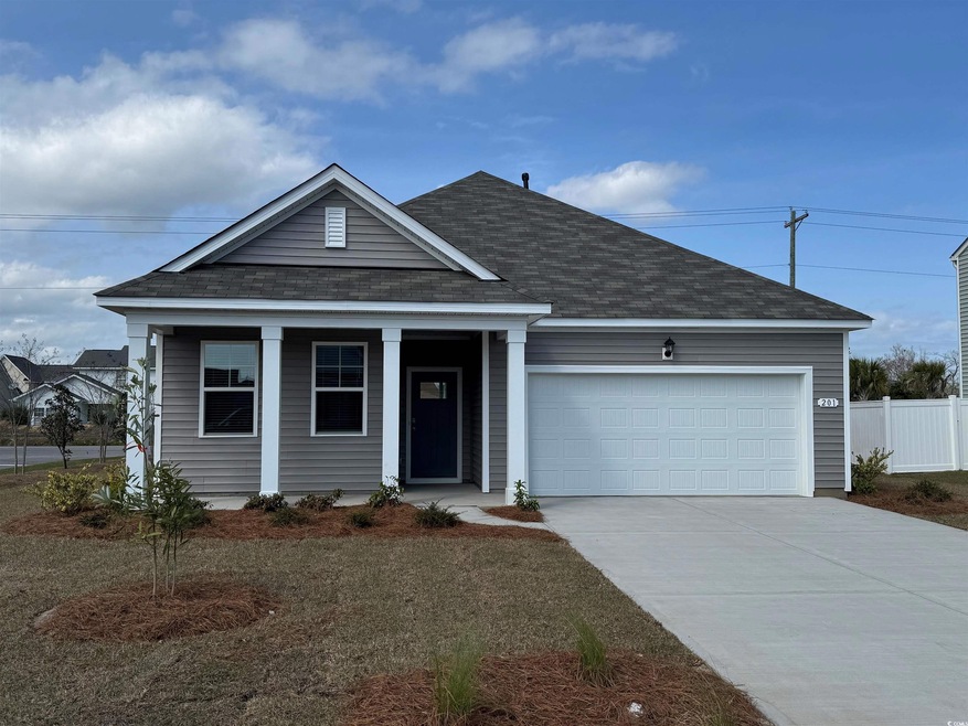 Ranch-style home featuring driveway, a shingled ro
