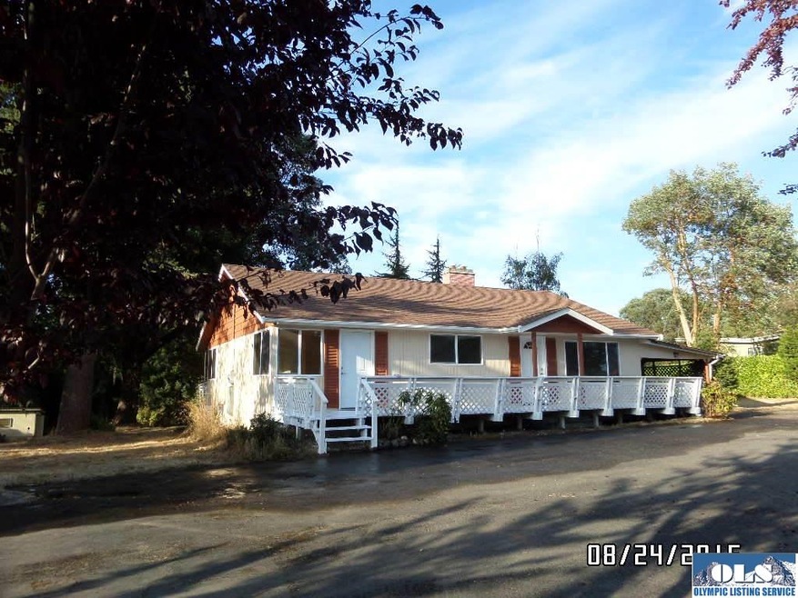 West side with asphalt paving & entrance to bonus 