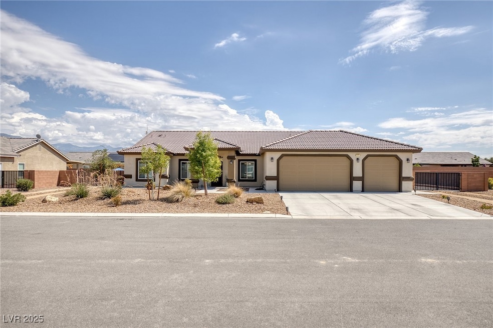 Mediterranean / spanish-style home with a garage,