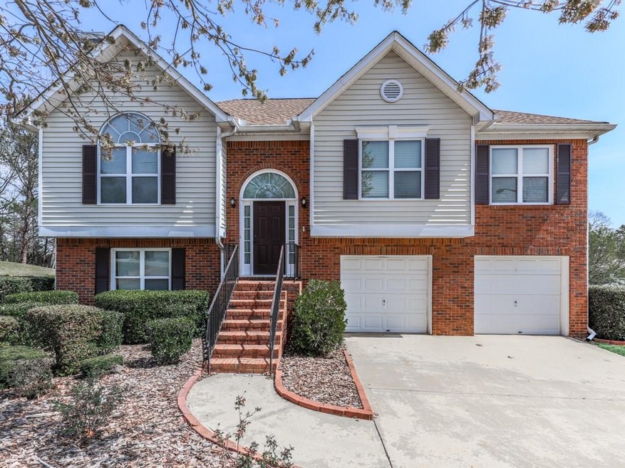 Front elevation, brick front with level driveway