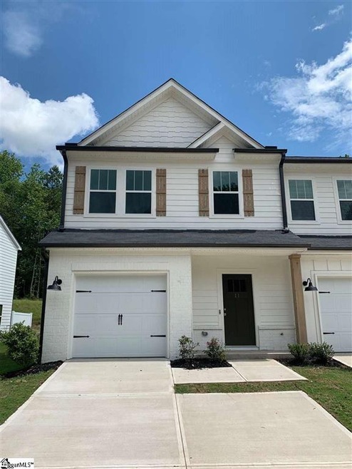 End Unit with Extra Poured Parking Pad!