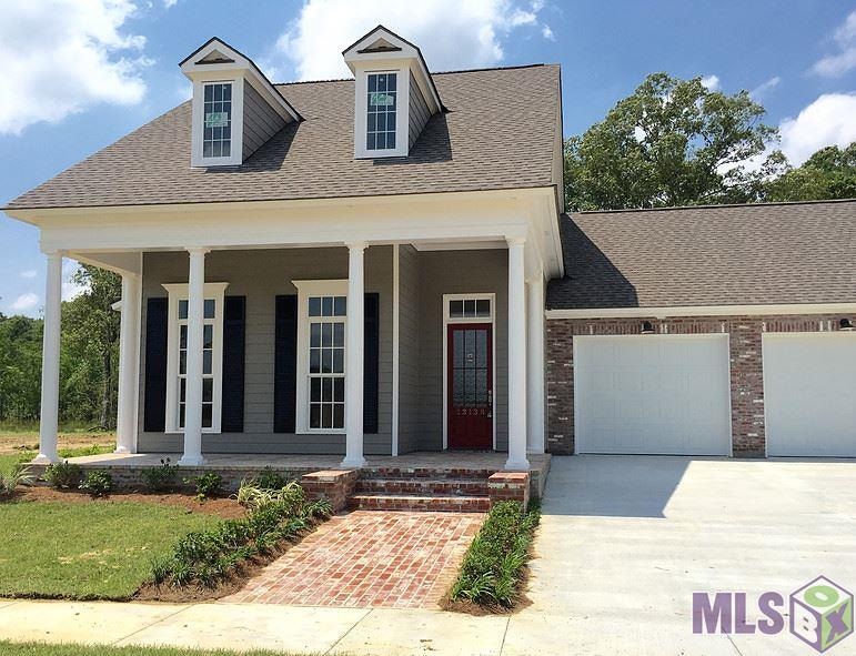 Beautiful style with brick front porch, custom shu