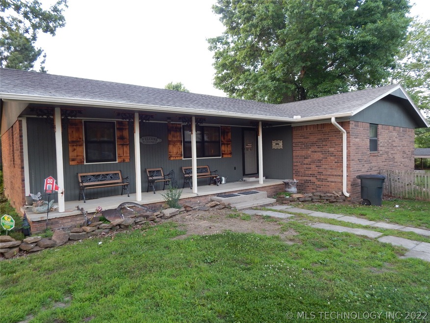 Front of home faces SW, repainted large covered po