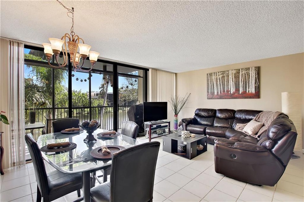 Open living/dining area with an abundance of natur