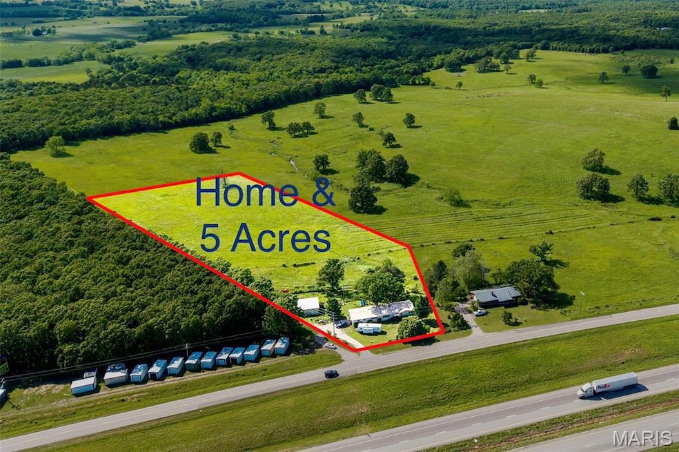 Aerial view of sparsely populated area with property boundaries highlighted