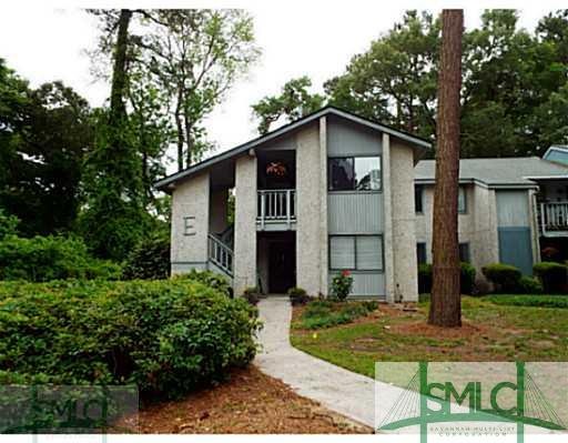 Exterior Front. Downstairs End Unit