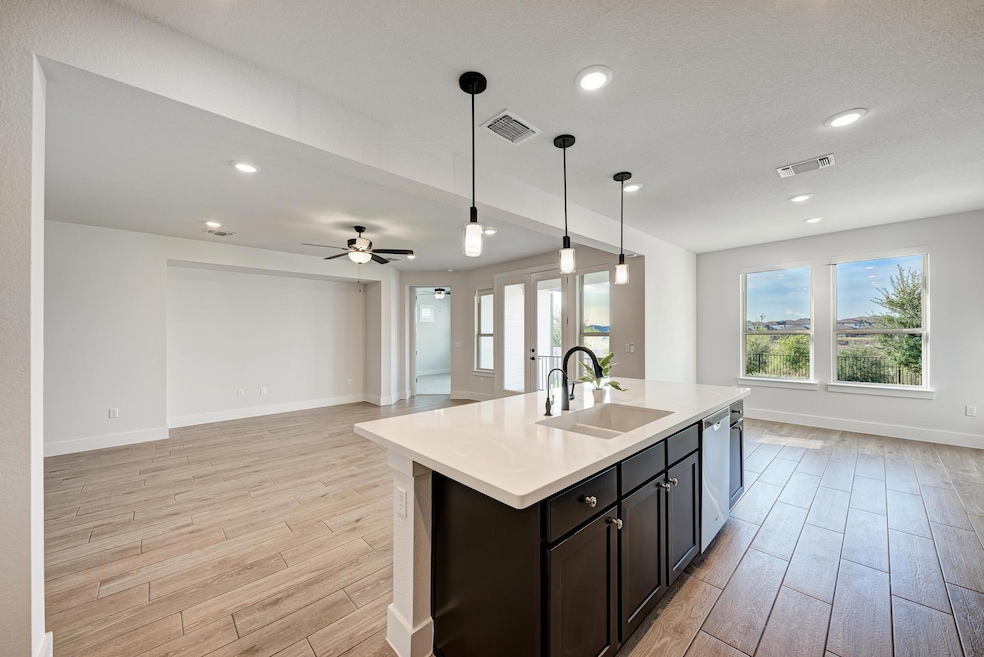 The kitchen overlooks the living room and dining are making it easy to stay connected while you whip up meals and clean up after dinner.
