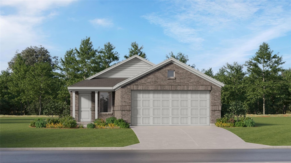 View of front of home featuring driveway, brick si