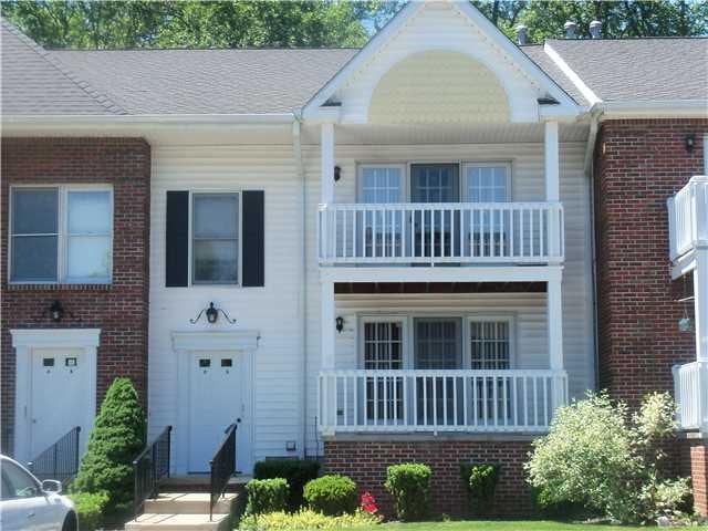Exterior Front. Lovely first floor condo with pati