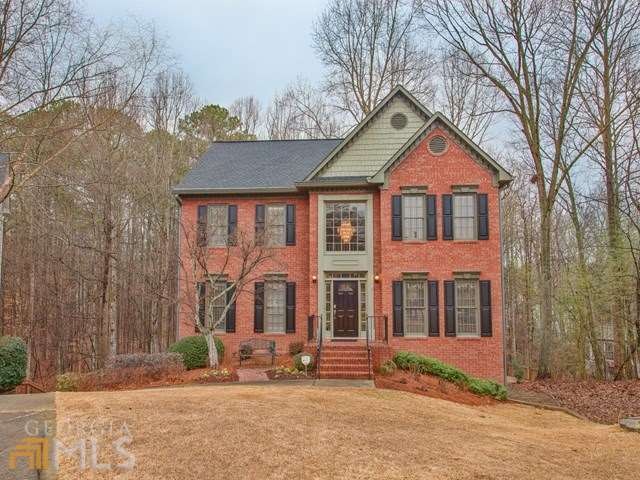 Gorgeous updated brick front home on wooded cul de