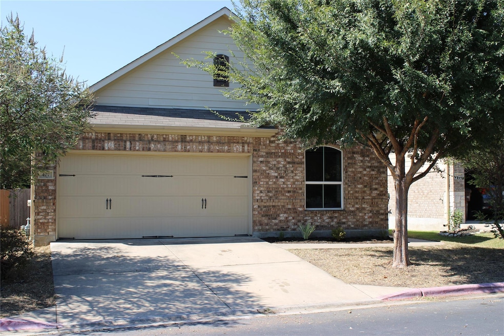 View of front of property with concrete driveway,