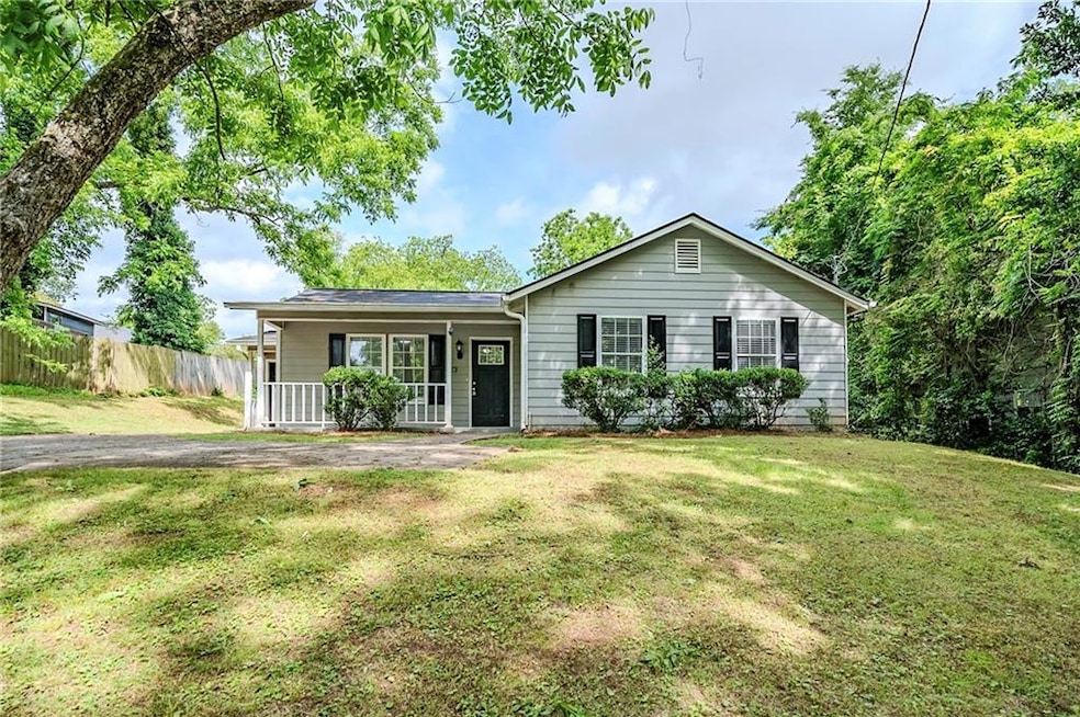 Ranch-style home featuring covered porch