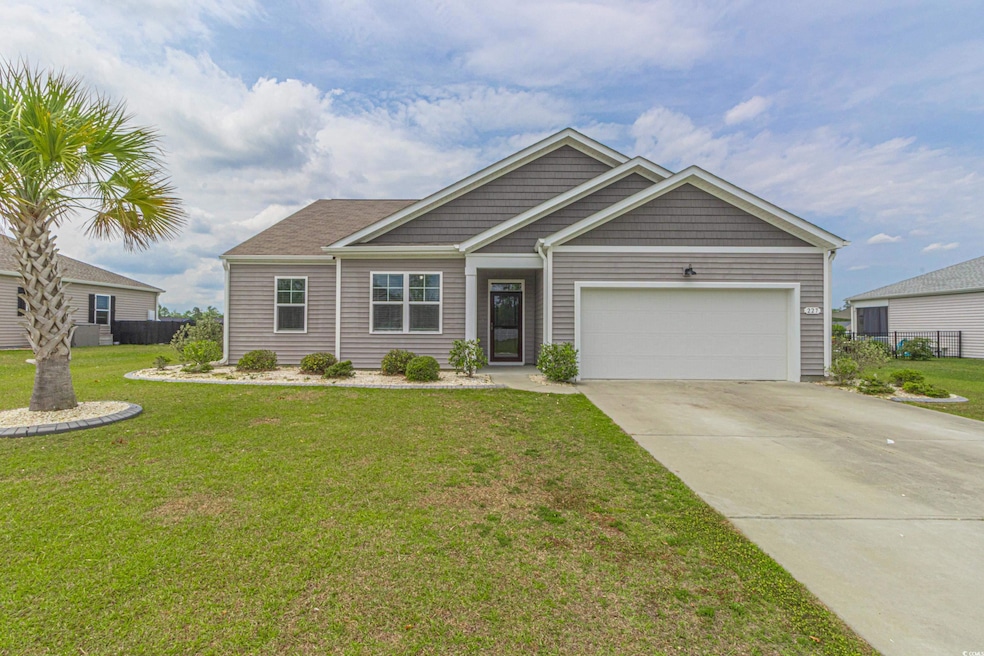 View of front of house featuring concrete driveway