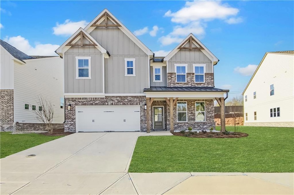 Craftsman-style house with a garage, concrete driv