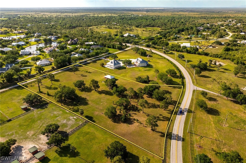 Bird's eye view with a view of trees and a rural v