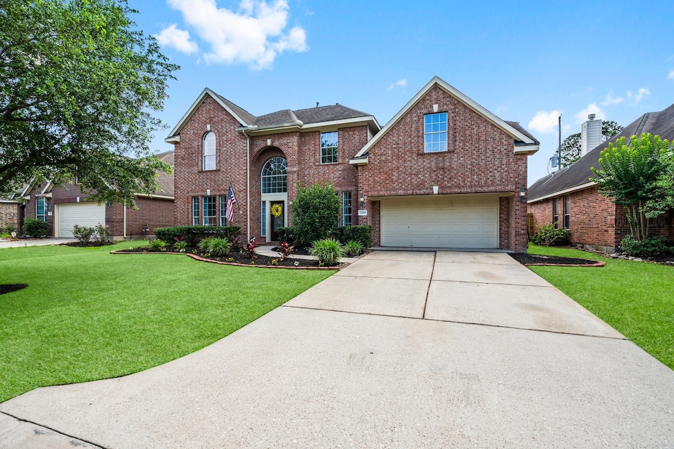 This stunning two-story brick home offers timeless