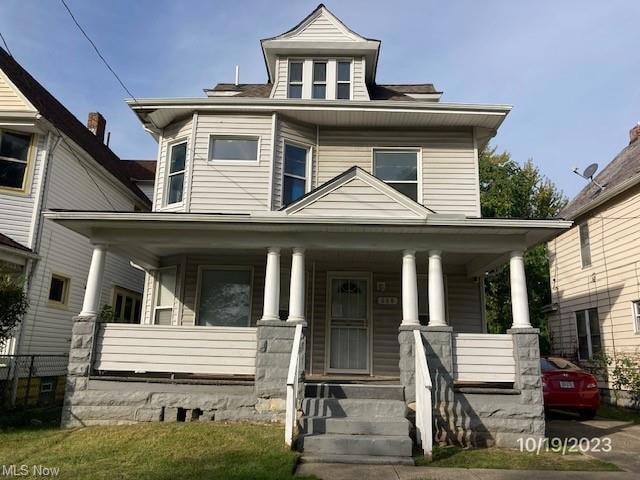 View of front of house with covered porch