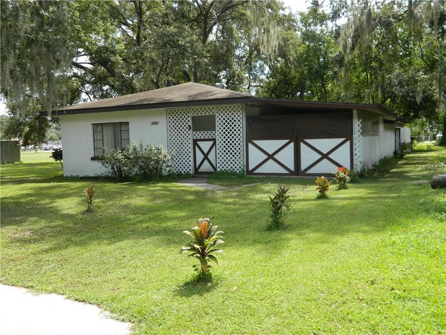 Front of home with enclosed carport
