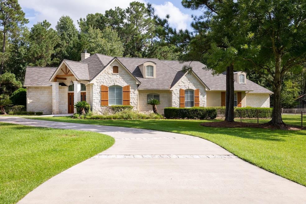 Semi circle driveway  in the front for visitors and separate gated driveway to the three car garage