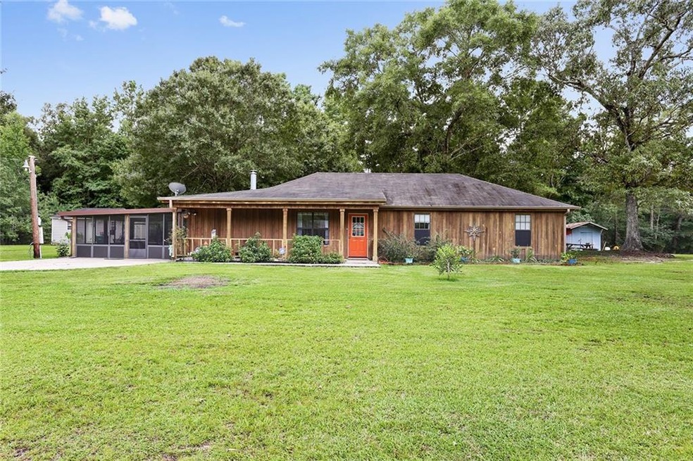 Front Exterior - Beautiful cedar siding, covered f