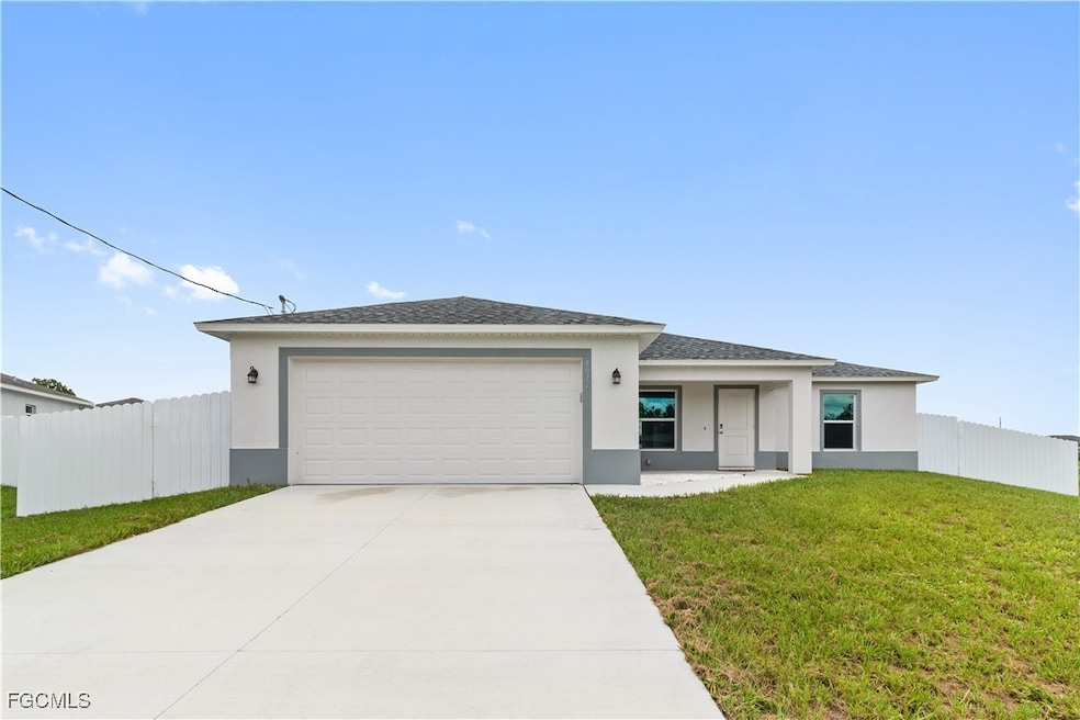 View of front of home with stucco siding, concrete driveway, an attached garage, and a shingled roof