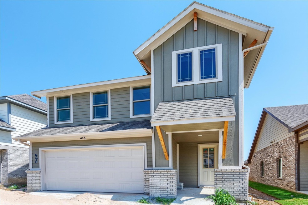 View of front of home featuring a garage