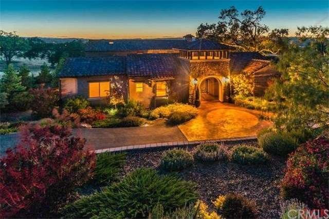 Front of home with lush landscaping