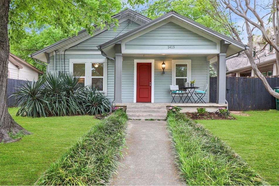 Bungalow-style home with a porch and a front yard