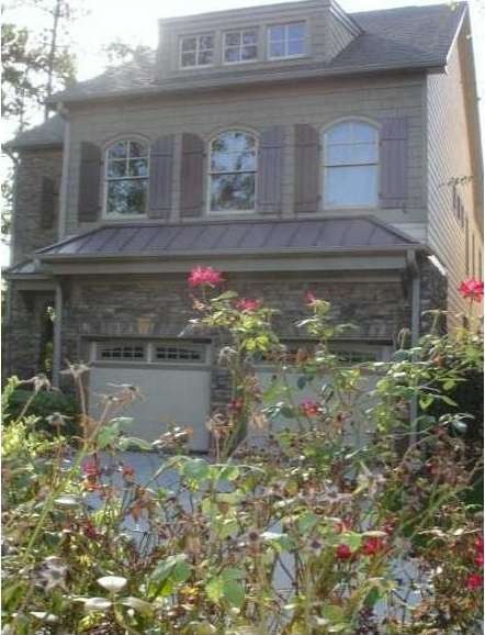 Exterior Front. STONE AND HARDI BOARD HOME WITH GR