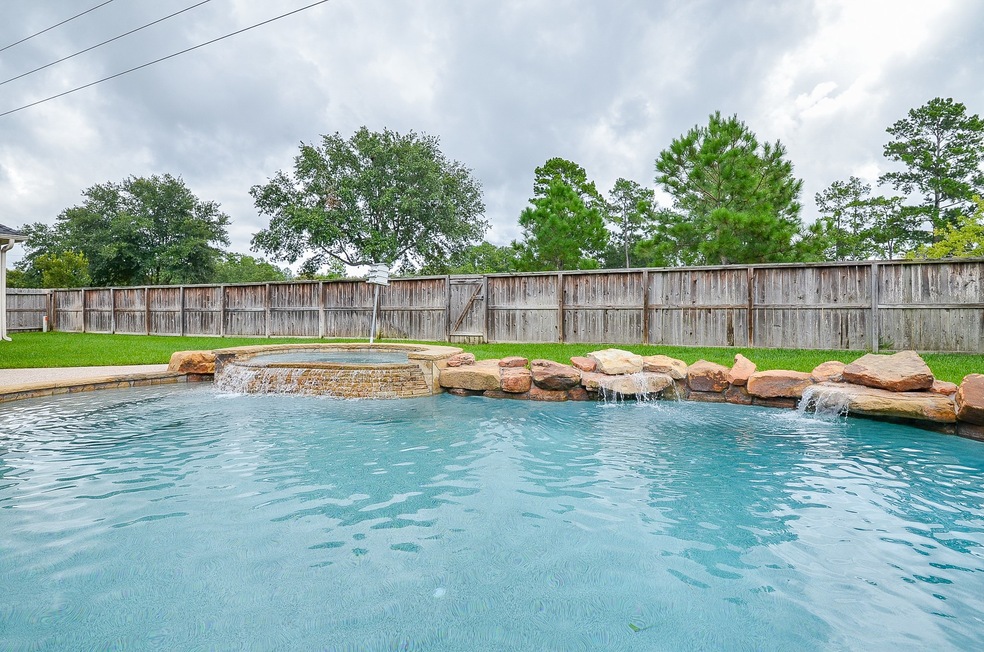 Sparkling Pool with waterfalls and hot tub in a very private backyard!