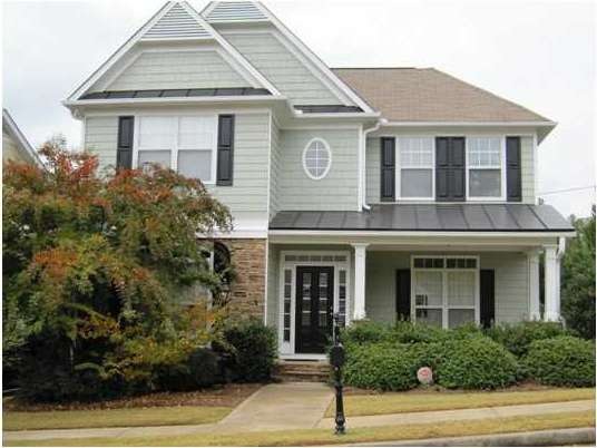 Exterior Front. Rocking chair front porch. Cement 
