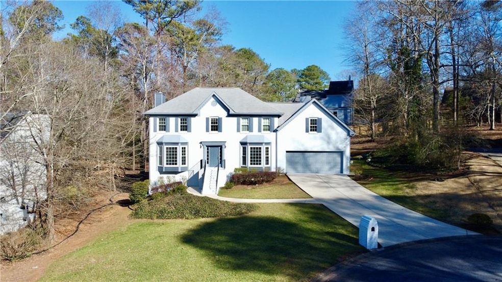 Colonial-style house featuring a front yard and a 