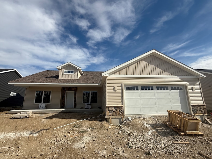 Low maintenance vinyl siding and stylish stone.