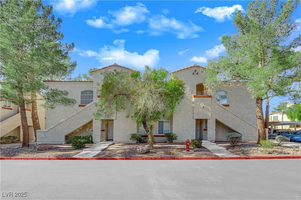 Mediterranean / spanish house with stairs and stucco siding