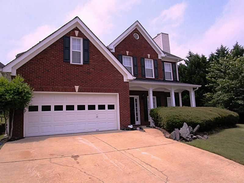 Exterior Front. Brick front, 3 side with concrete 