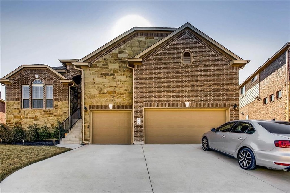 Grand entrance with upgraded stone front, hill country views and a park across the street. 