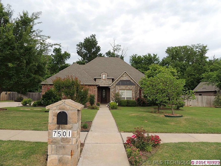 This full brick and stone home with a 3 car side e