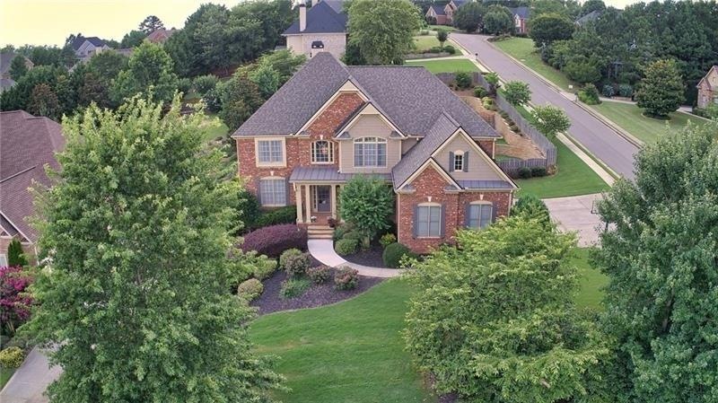 EXQUISITE 3 sided BRICK, 3 car garage, corner lot 