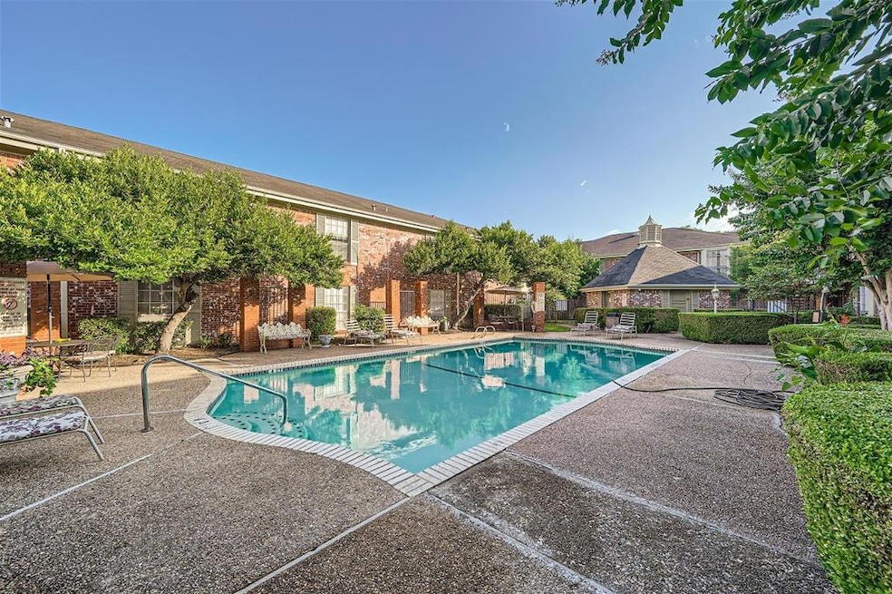 Community pool featuring a patio