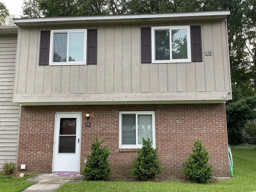 View of front facade featuring brick siding