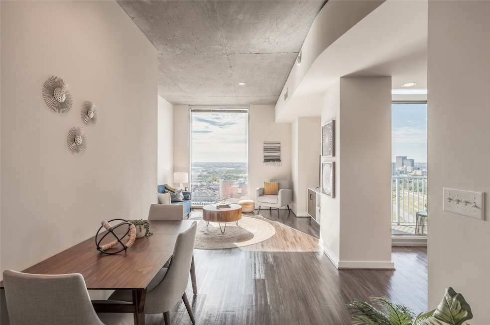 This gorgeous unit features expansive floor-to-ceiling windows that flood the space with natural light and offer sweeping city views.