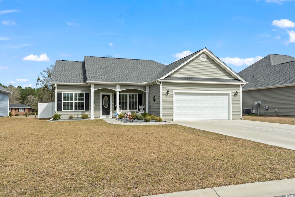 Ranch-style home featuring a front lawn, driveway,