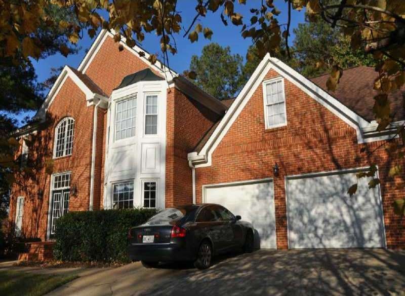 Exterior Front. Level parking for 3 cars