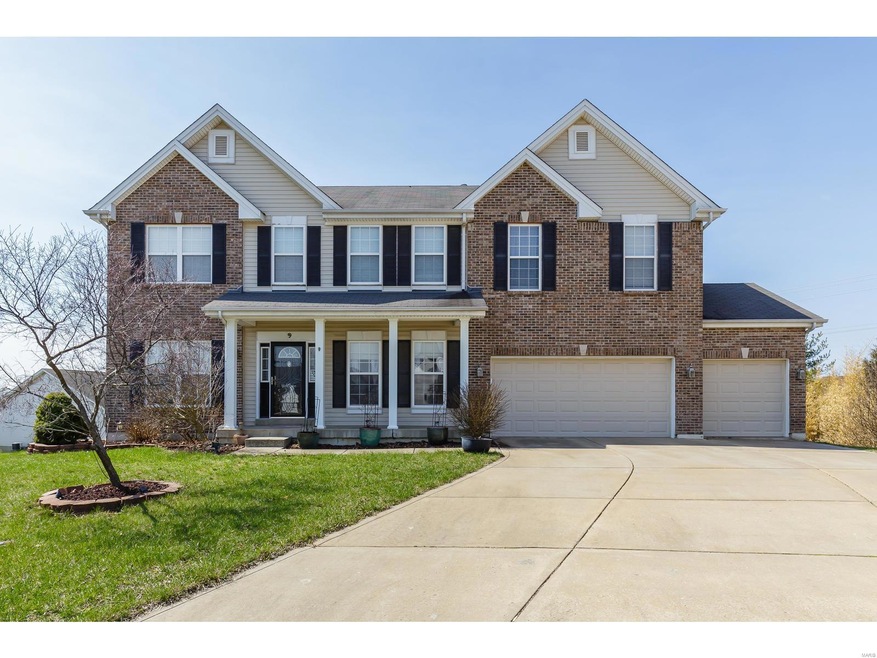 Covered front porch on this lovely brick front 3 c