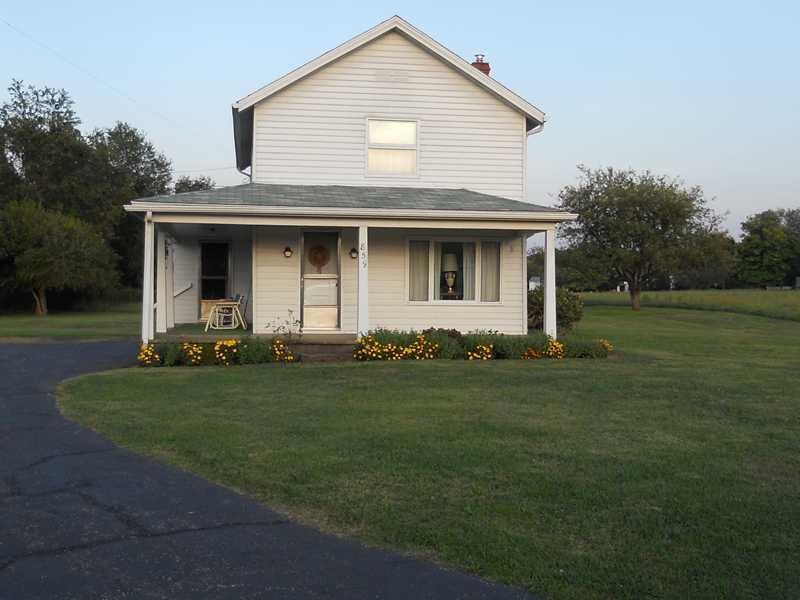 Exterior Front. Charming farmhouse with wrap-aroun