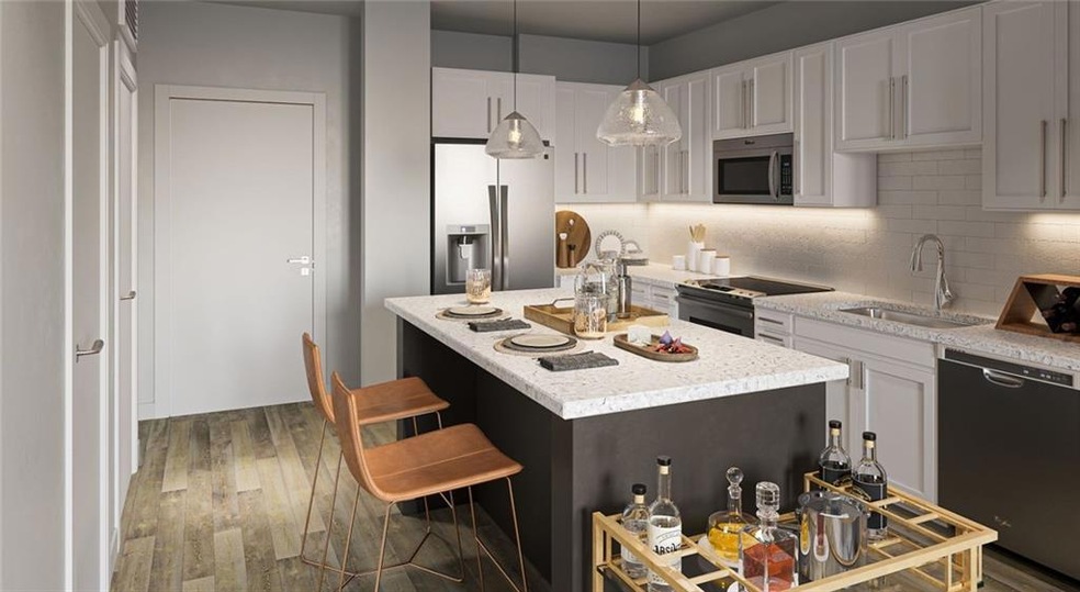 Kitchen with tasteful backsplash, appliances with 