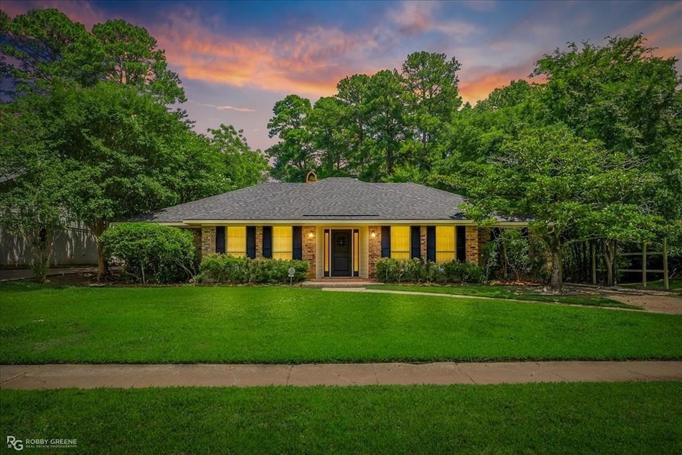 Ranch-style house with a lawn